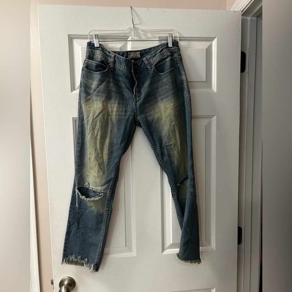 Free people cropped and distressed jeans.